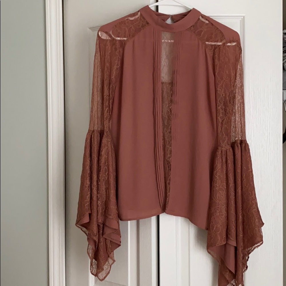 Women’s blouse with flared sleeves